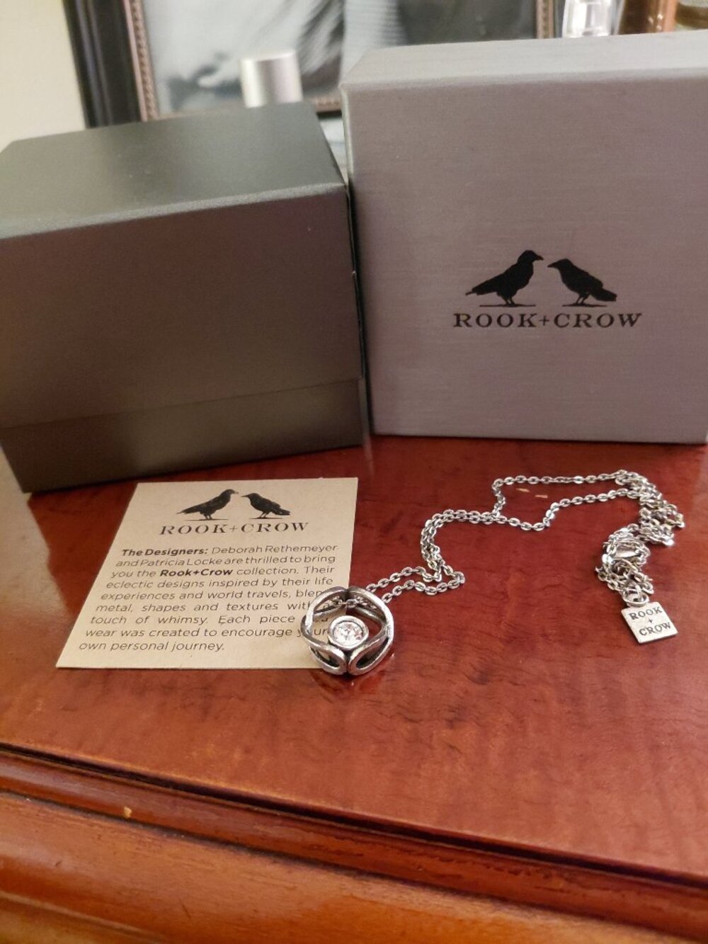Rook and Crow crystal circle silver pendant NIB